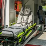 Inside view of a modern emergency ambulance showing a stretcher for patient transport.