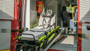Inside view of a modern emergency ambulance showing a stretcher for patient transport.
